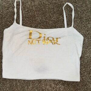 NAKED WARDROBE SOLID VIBES WHITE CROP TANK W GOLD DIOR NOT WAR METALLIC LOGO L
